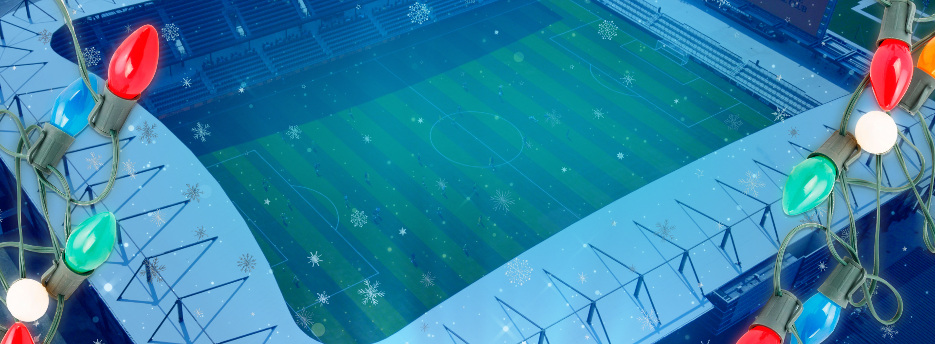 Aerial view of Ruoff Mortgage Stadium at night with falling snowflakes